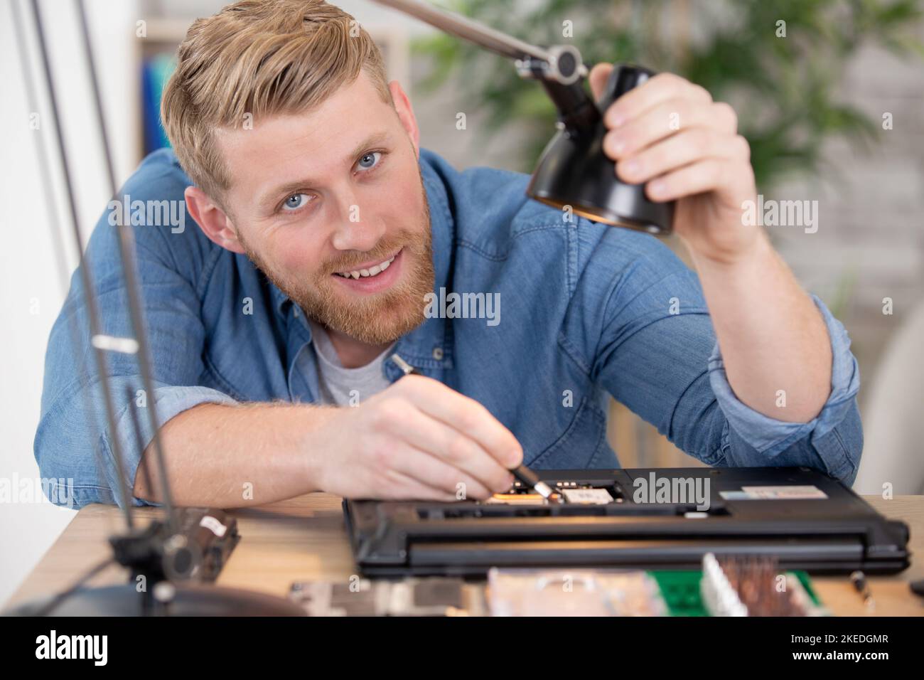 happy and successful young computer engineer Stock Photo
