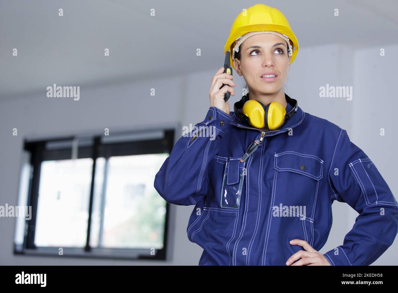 woman builder on the phone Stock Photo