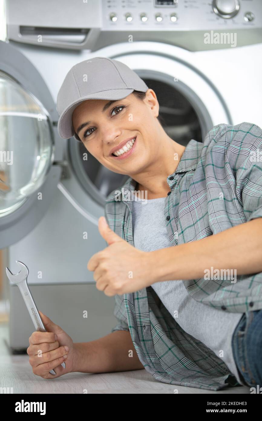 female worker showing thumb up to the camera Stock Photo