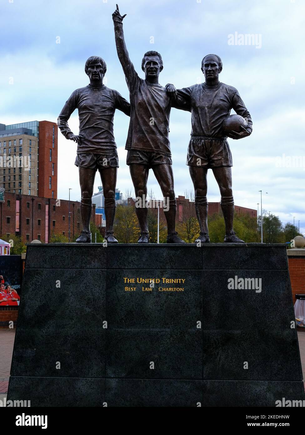 United Trinity Statue in front of Manchester United Football Club Stadium, Old Trafford, Manchester, Greater Manchester, England, UK. Stock Photo