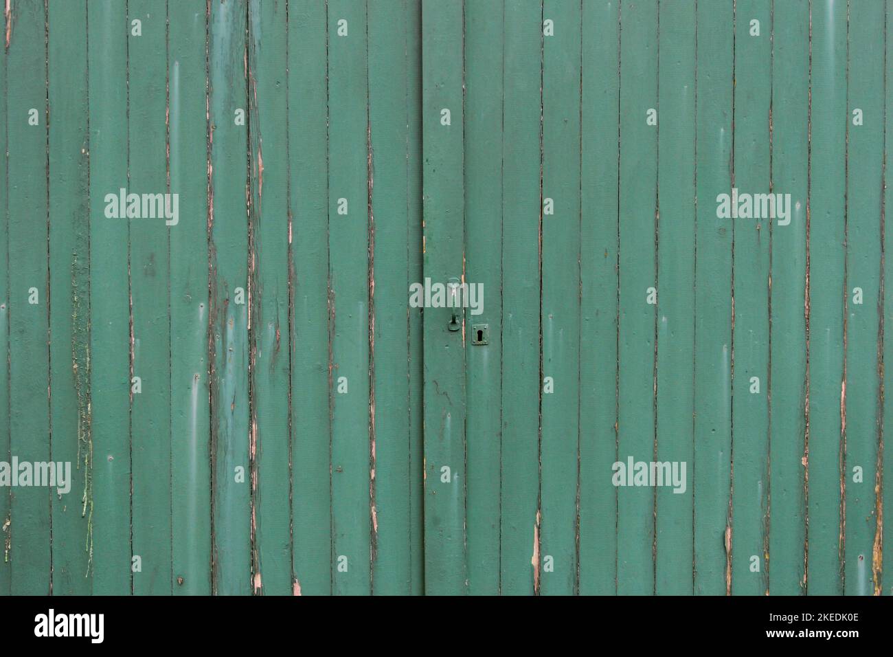 peeling wooden staves of a door – a texture Stock Photo