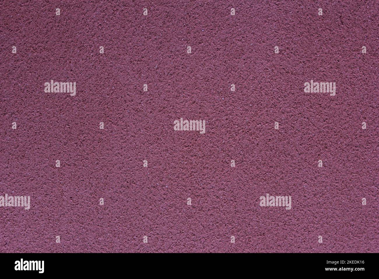 plum-coloured stucco surface texture Stock Photo