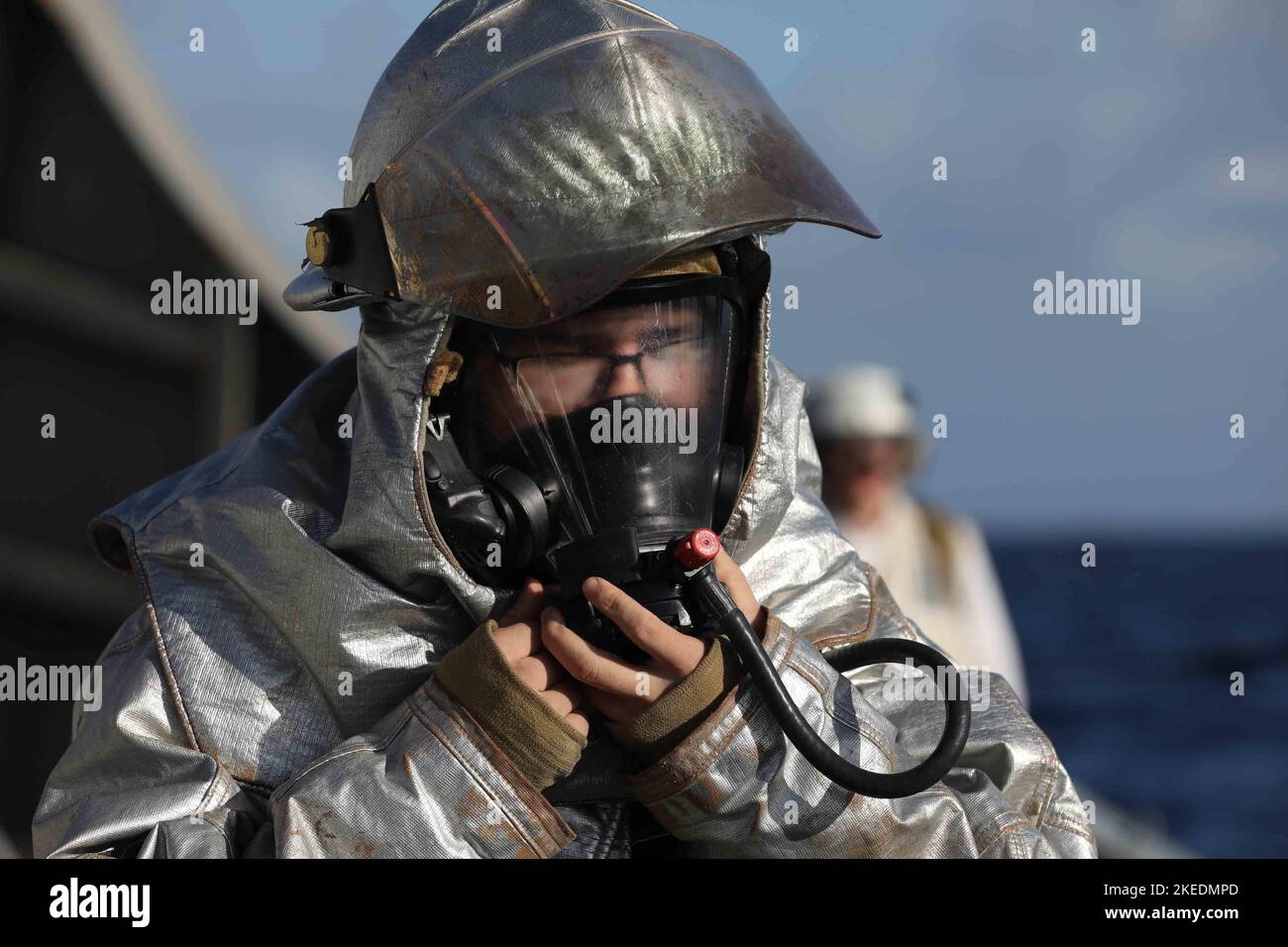 Damage Controlman 3rd Class Victor Alvarez activates his self-contained breathing apparatus during an aircraft firefighting drill aboard the Arleigh Burke-class guided-missile destroyer USS McFaul (DDG 74) while underway as part of the Gerald R. Ford Carrier Strike Group, Nov. 8, 2022, during exercise Silent Wolverine. Exercise Silent Wolverine is a U.S.-led, combined training exercise that tests Ford-class aircraft carrier capabilities through integrated high-end naval warfare scenarios alongside participating allies in the Eastern Atlantic Ocean. The Gerald R. Ford Carrier Strike Group is co Stock Photo