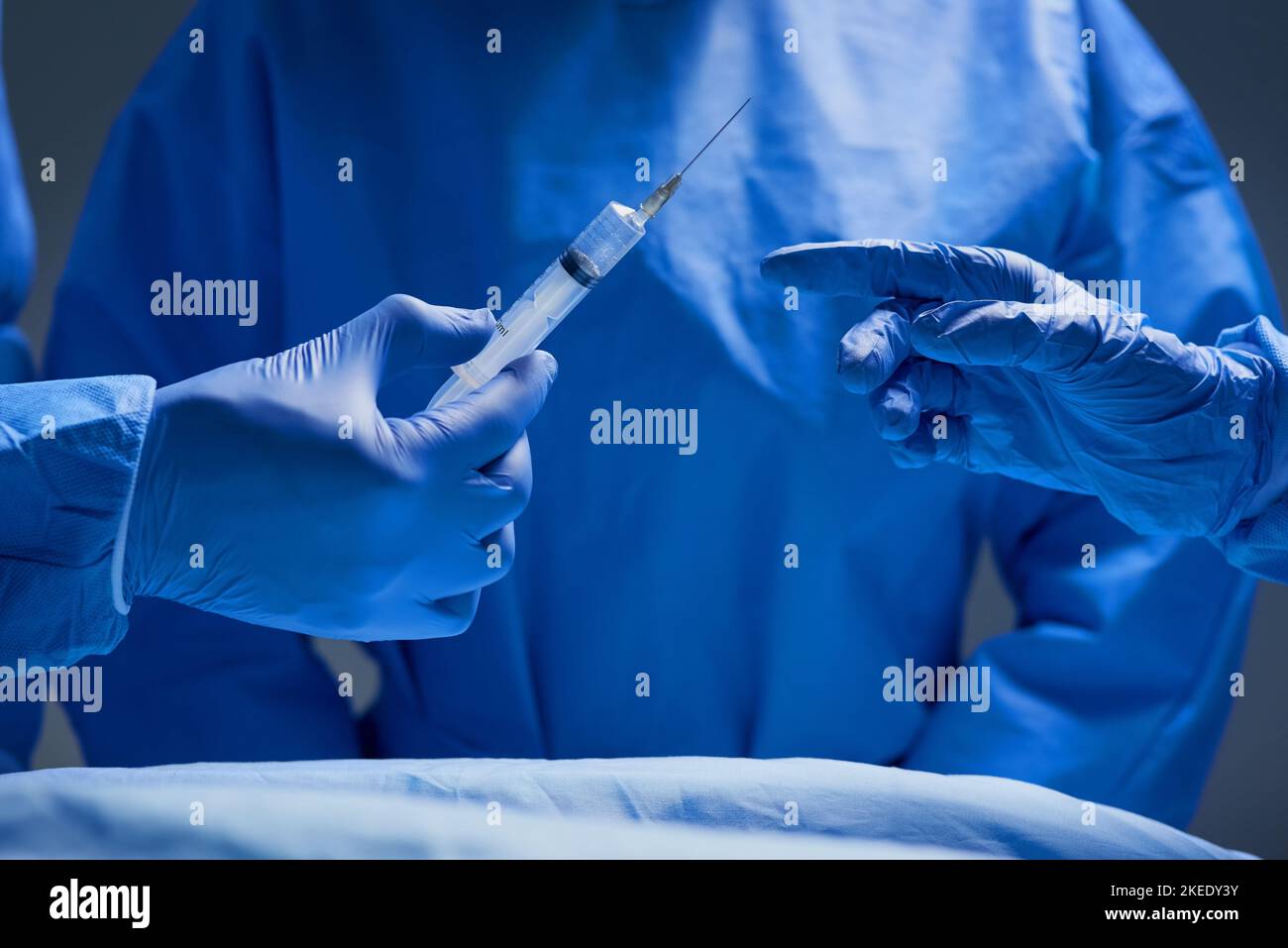 Local anesthesia please. Closeup shot of group of surgeons working on a patient in an operating