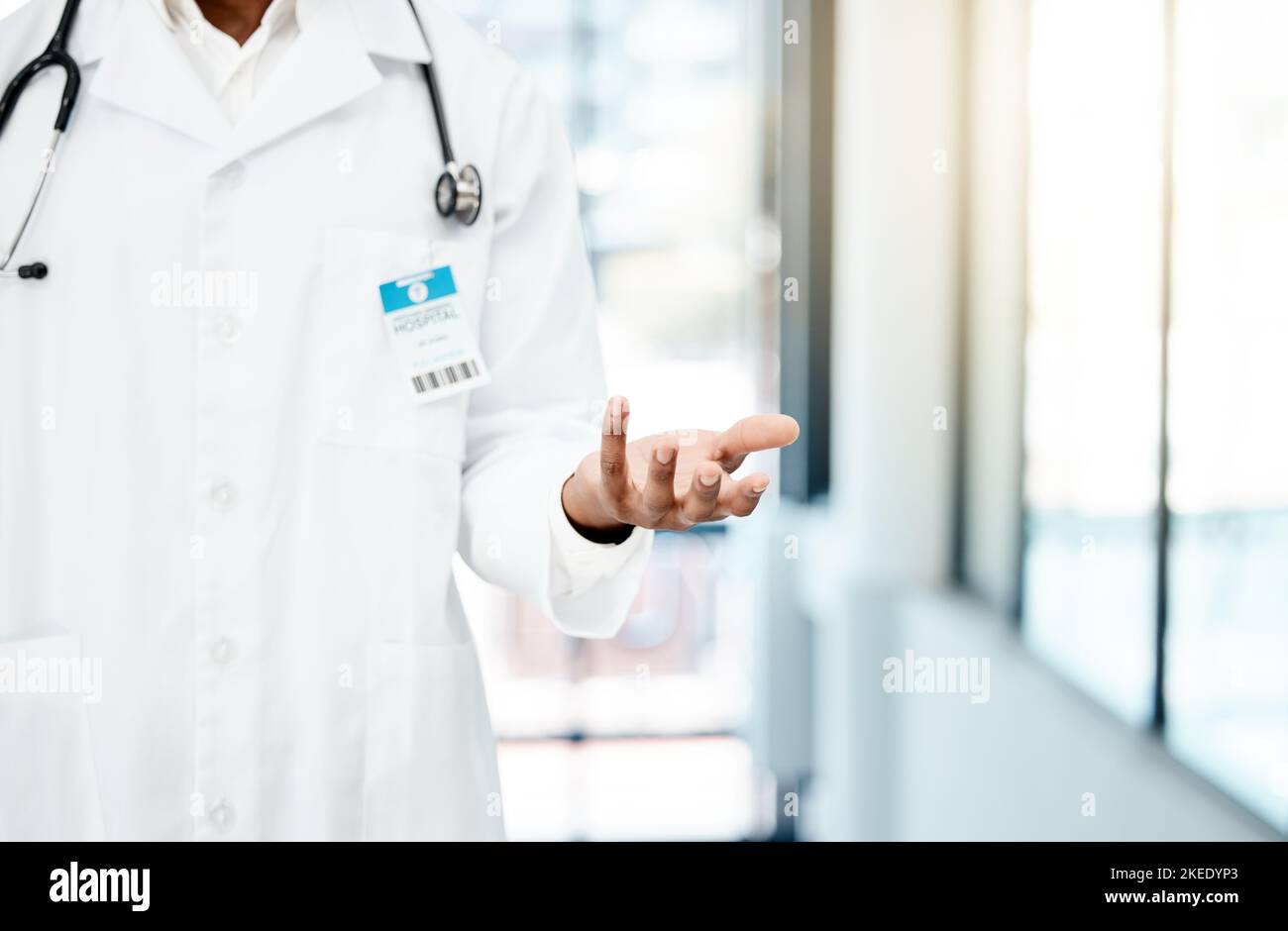 Product placement, confused and hand of a doctor marketing insurance, healthcare and medicine. Advertising, medical and hospital worker with mockup Stock Photo
