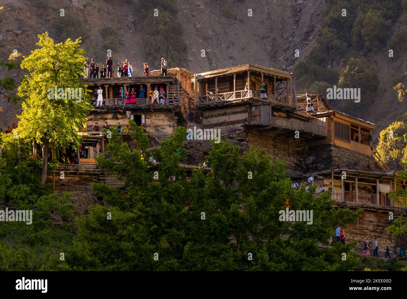 peoples of kalash are standing on the roofs an old and traditional village in chitral Stock Photo
