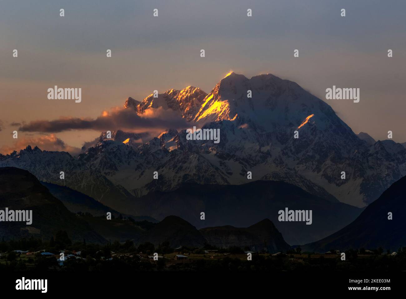 snow mountain in sunset golden light , tirich mir peak in hindukush range chitral Pakistan, Stock Photo