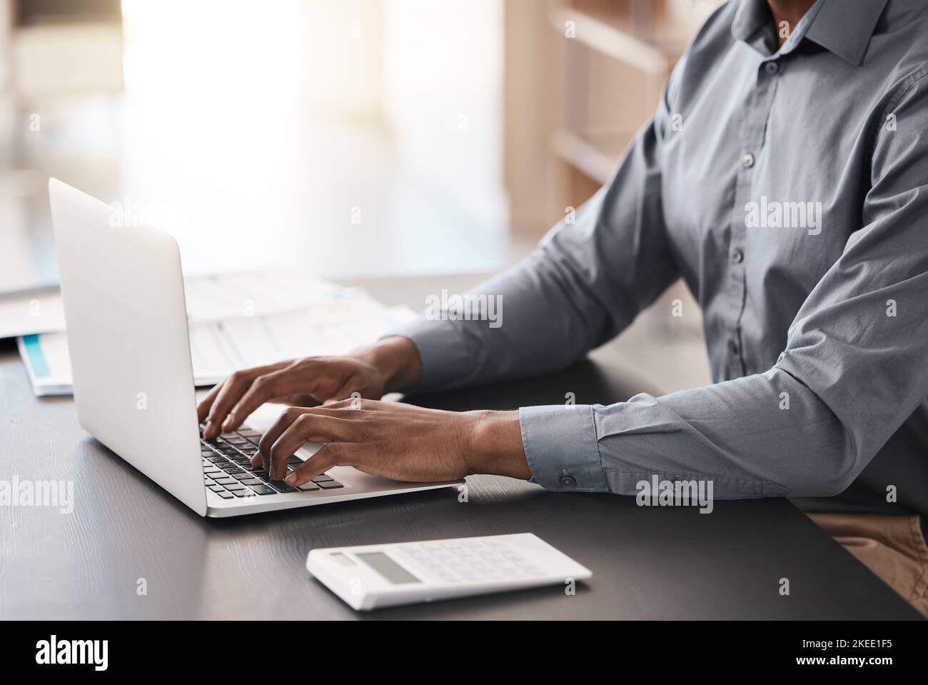 Laptop, hands typing and business man in office working on job email or report. Digital research, developer and programmer writing, programming Stock Photo