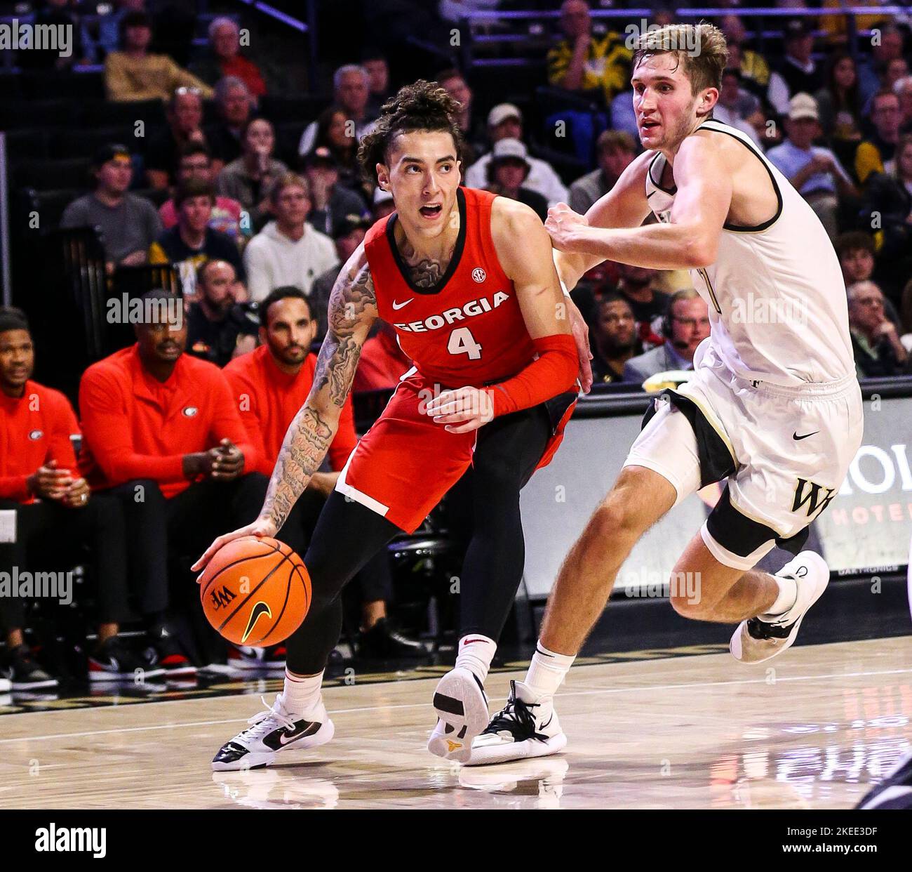 November 11, 2022: Georgia sophomore Jusaun Holt (4) drives past Wake Forest junior Andrew Carr (11). NCAA basketball game between University of Georgia and Wake Forest University (during first half) at Lawrence Joel Veterans Memorial Coliseum, Winston Salem. NC David Beach/CSM Stock Photo