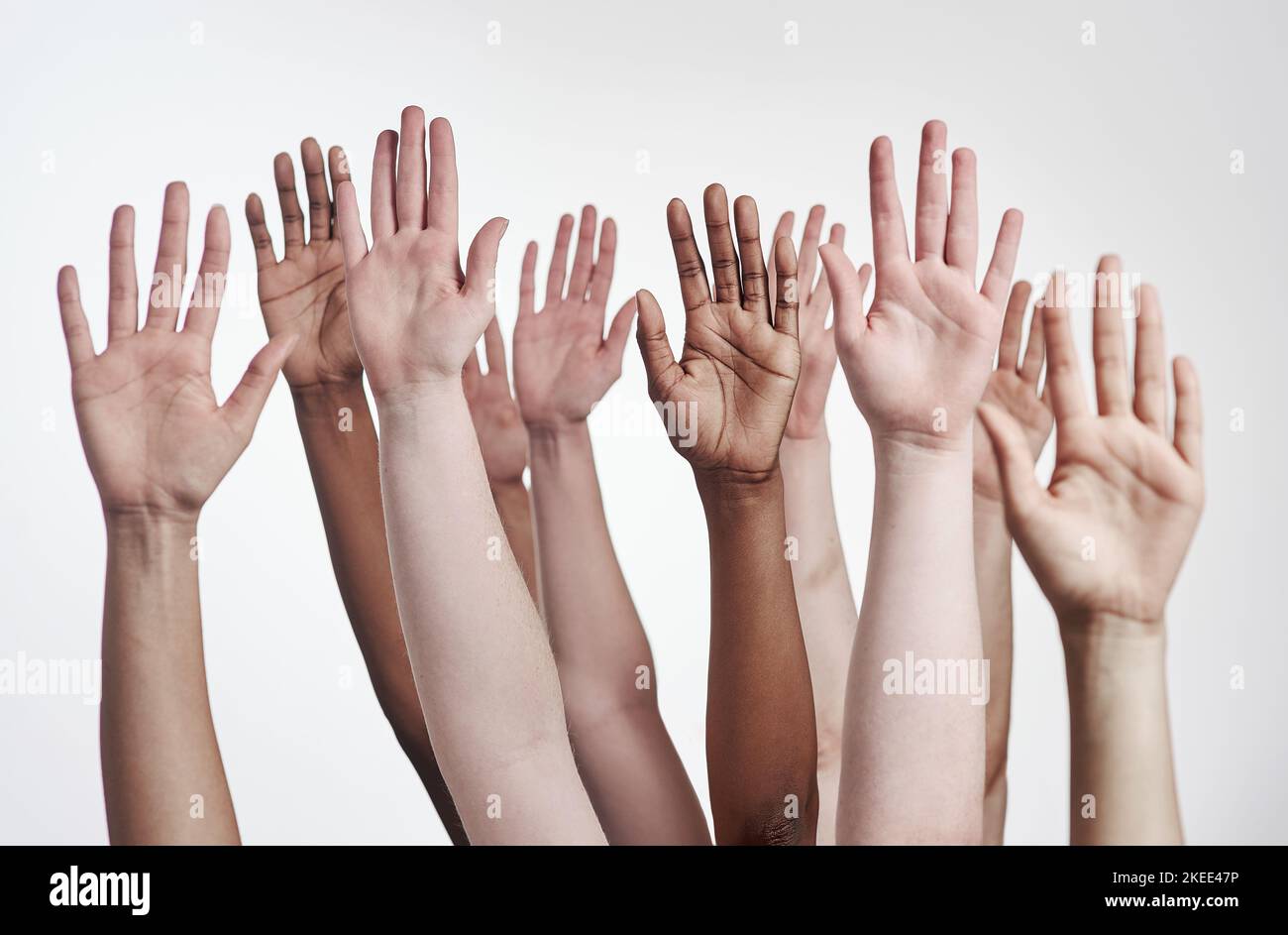 Lets develop our strengths together. a group of hands reaching up
