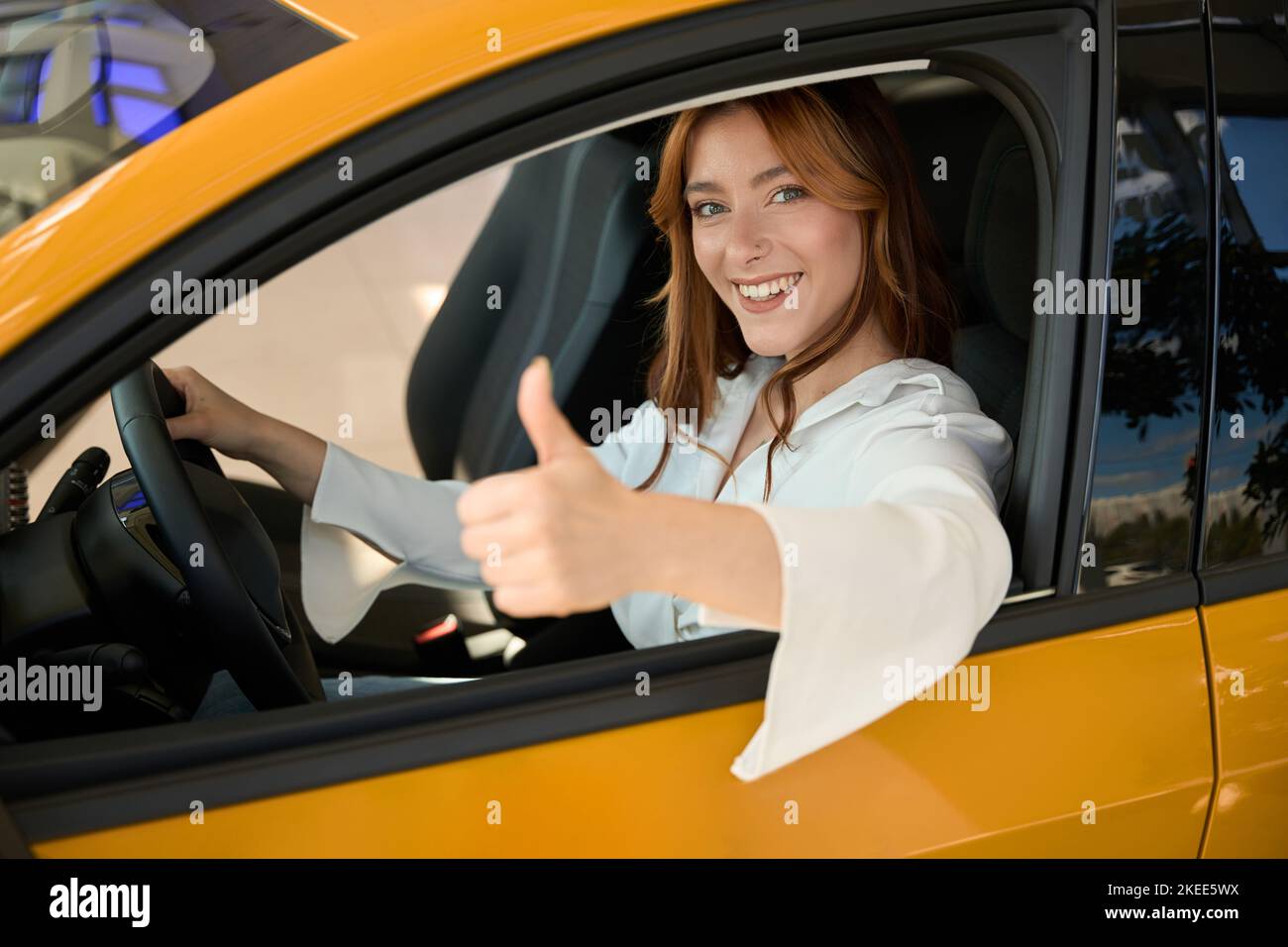 Woman seated at steering wheel hi-res stock photography and images - Alamy