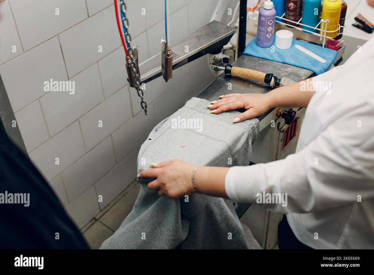 Dry cleaning clothes. Clean cloth chemical process. Laundry industrial