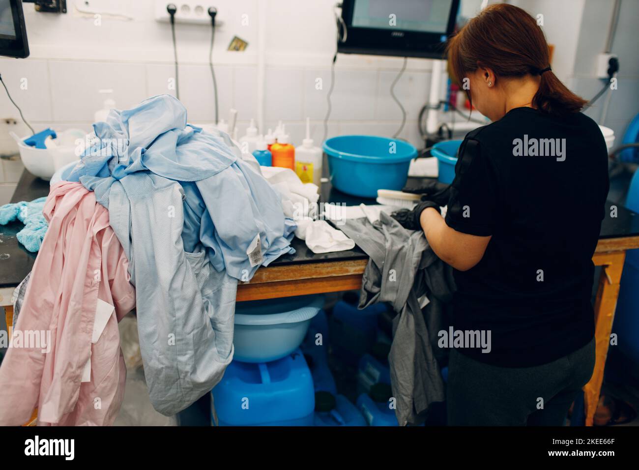 Dry cleaning clothes. Clean cloth chemical process. Laundry industrial