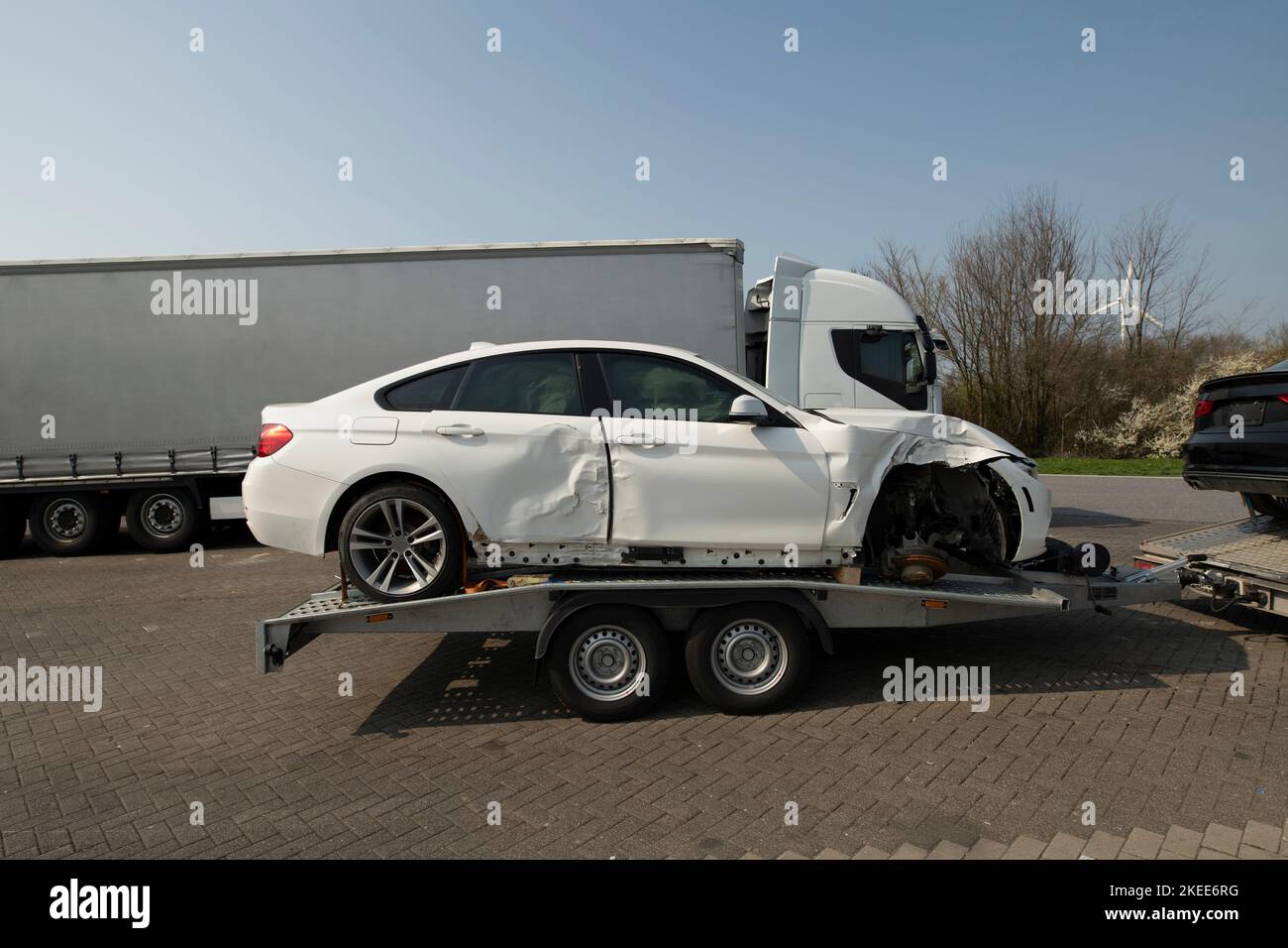 An accident vehicle on a trailer Stock Photo