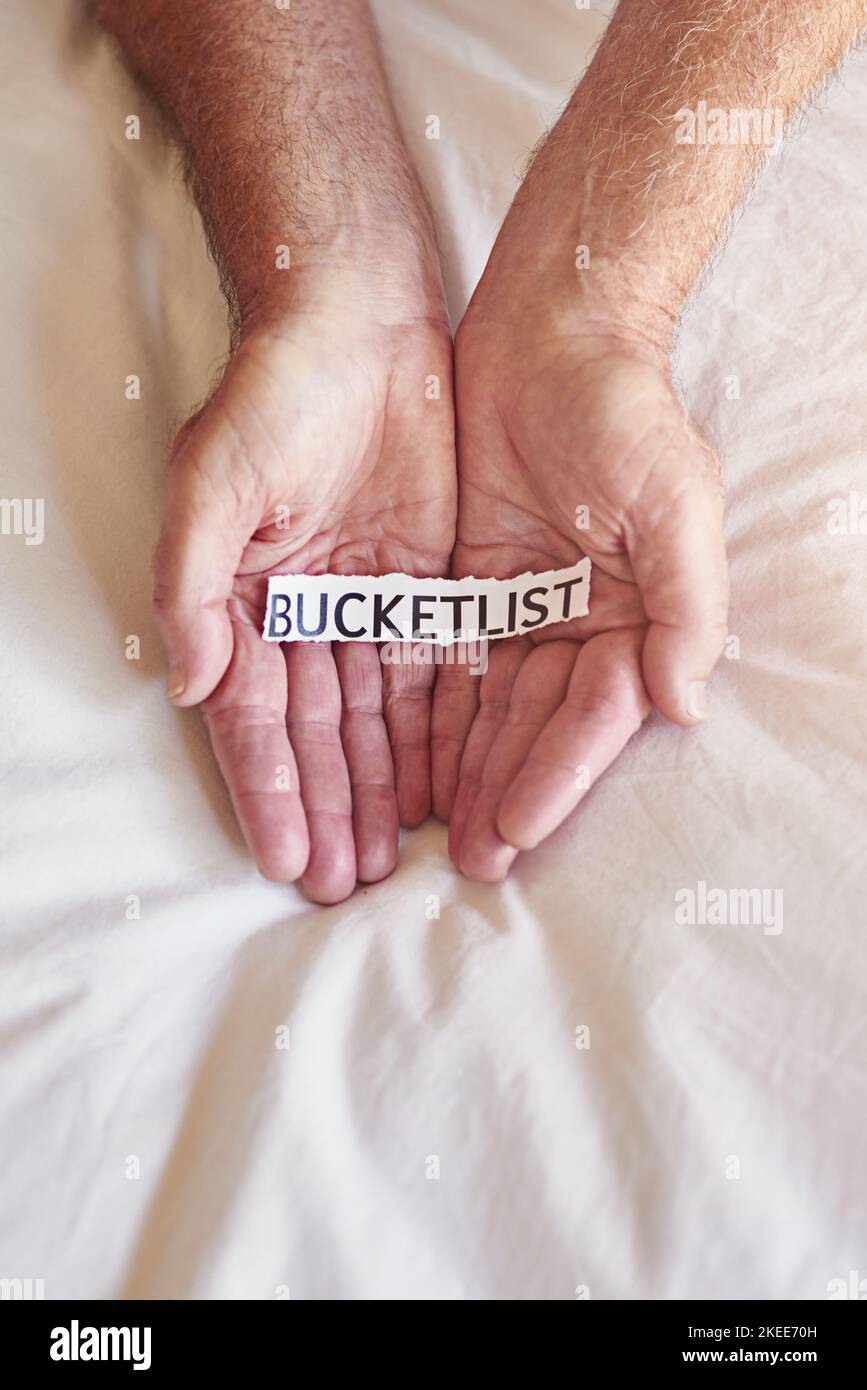 Whats on your bucket list a person holding a piece of paper with the