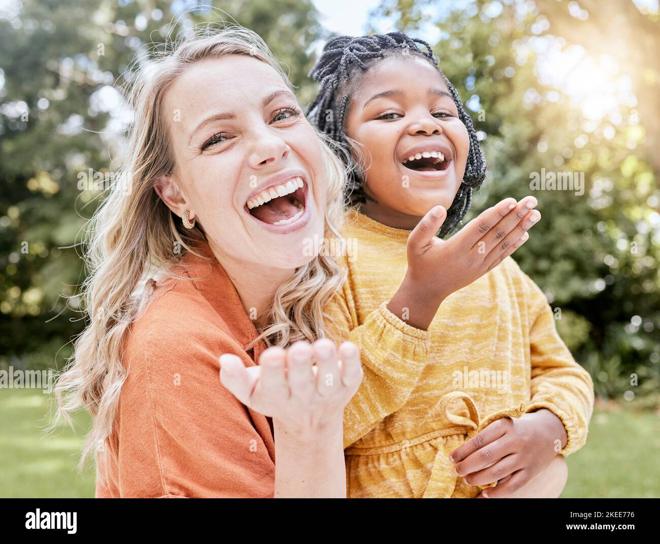 Adoption, mother and girl outdoor, smile or happy being loving, bonding or happy together. Portrait, adopted child or black girl with foster mother Stock Photo