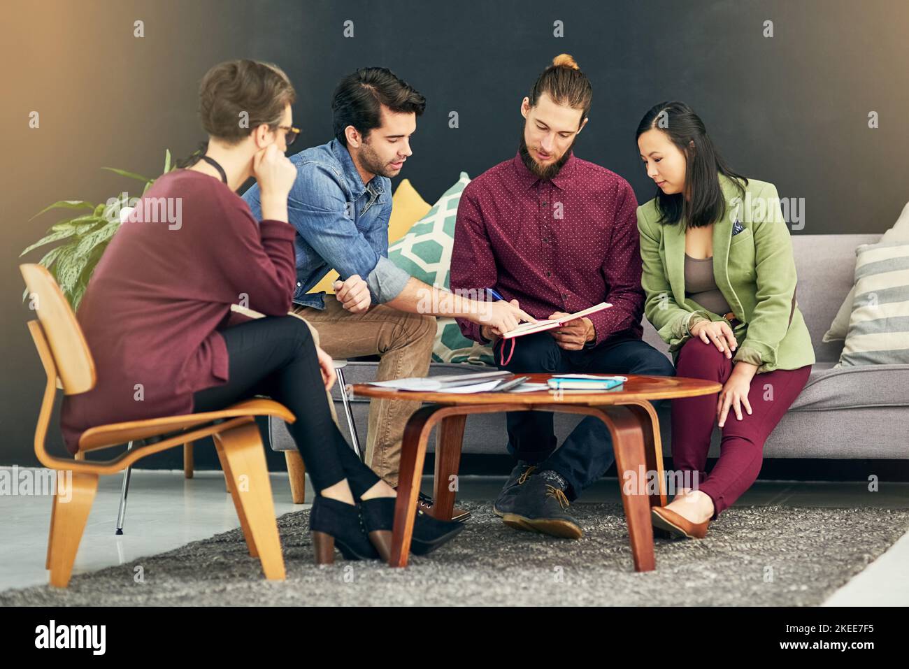 Achieving the impossible together as a team. a group of young creatives