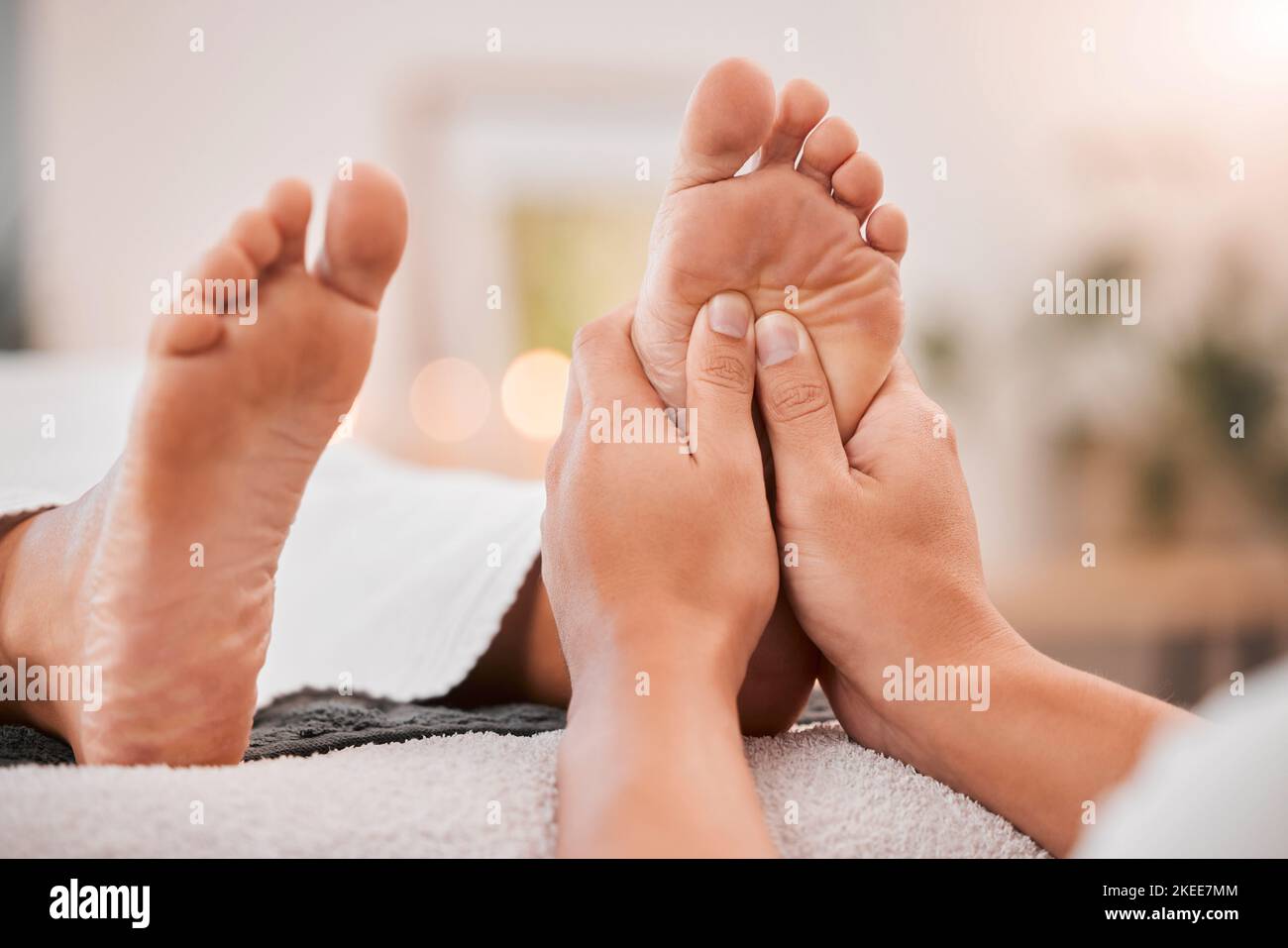 Foot massage, reflexology and podiatrist at luxury spa for woman feet