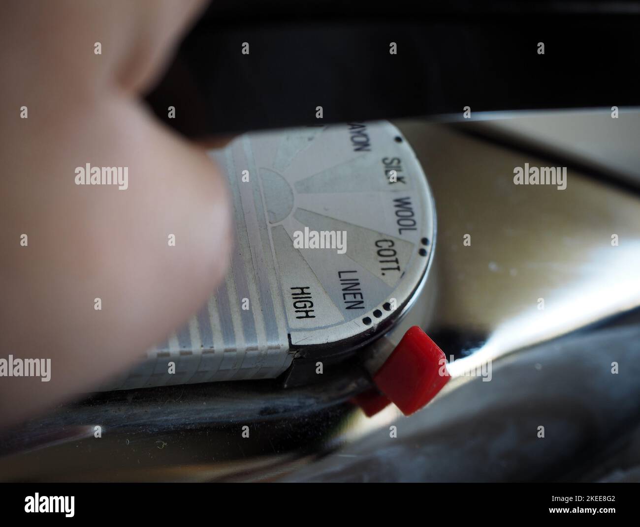 Marks showing the degrees of ironing on an old iron. Selected focus