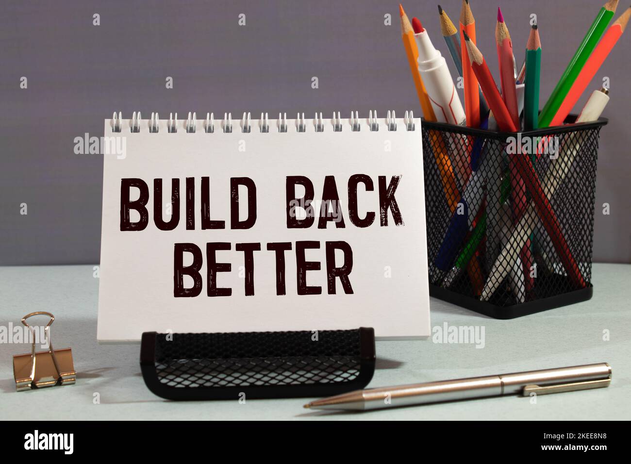 Build back better written in white chalk on a black chalkboard isolated on white Stock Photo