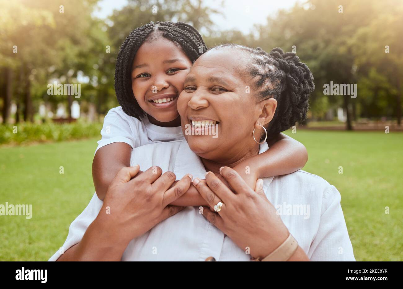 Portait, children and piggyback with a mother and daughter in a park ...