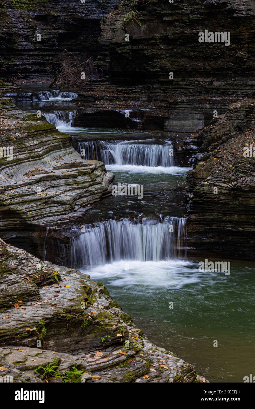 Gorge Over A vertical shot of the waterfall cascading over the gorge in Watkins ...