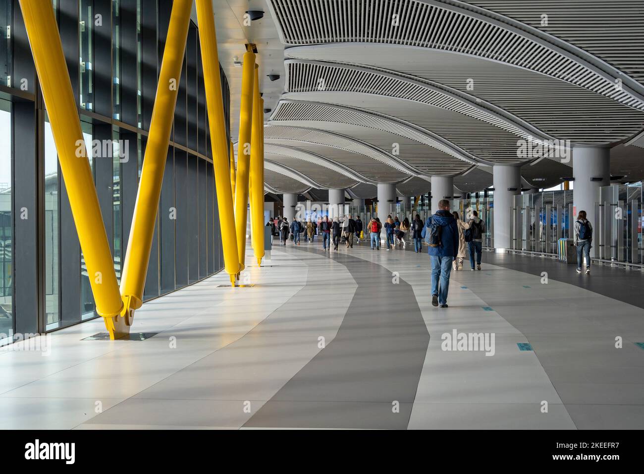 ISTANBUL - OCT 15: Passengers walking along the corridor of the new terminal Istanbul Havalimani airport on October 15. 2021 in Turkey Stock Photo