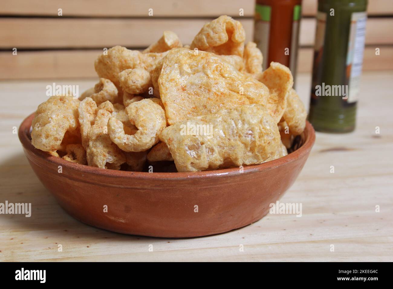 Fried Pork Rinds With Hot Sauce in Rustic Kitchen Stock Photo Alamy