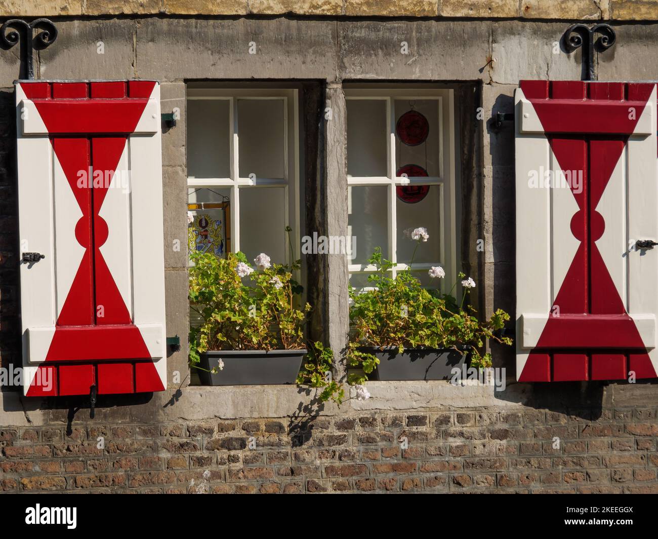 The typical Dutch window shutters at an old stone building in