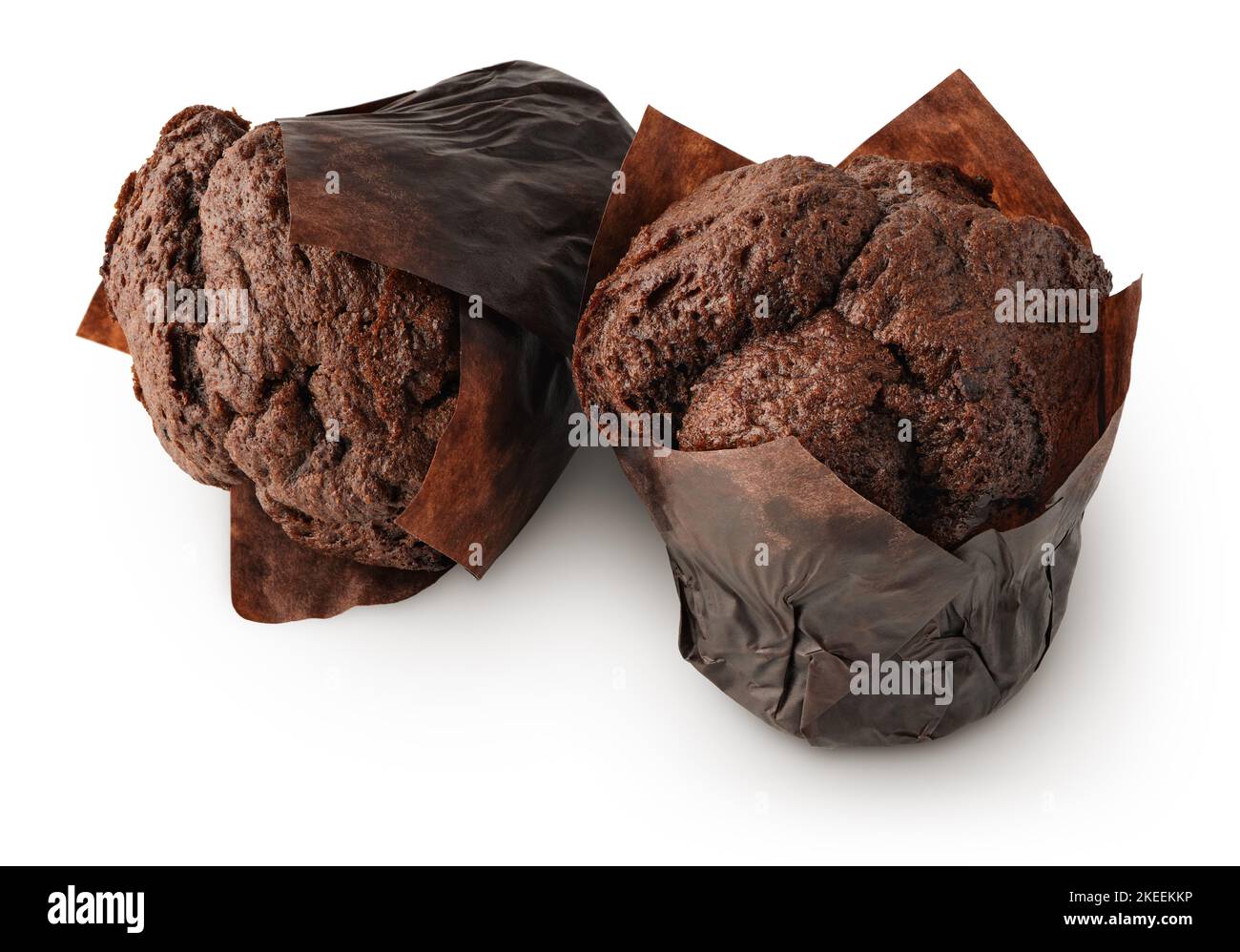 Two dark chocolate muffins, or cupcakes, isolated on white background Stock Photo