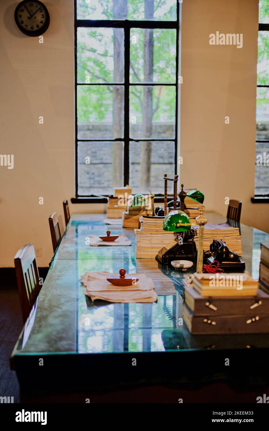 Vertical shot of old interior of post office table with stamps