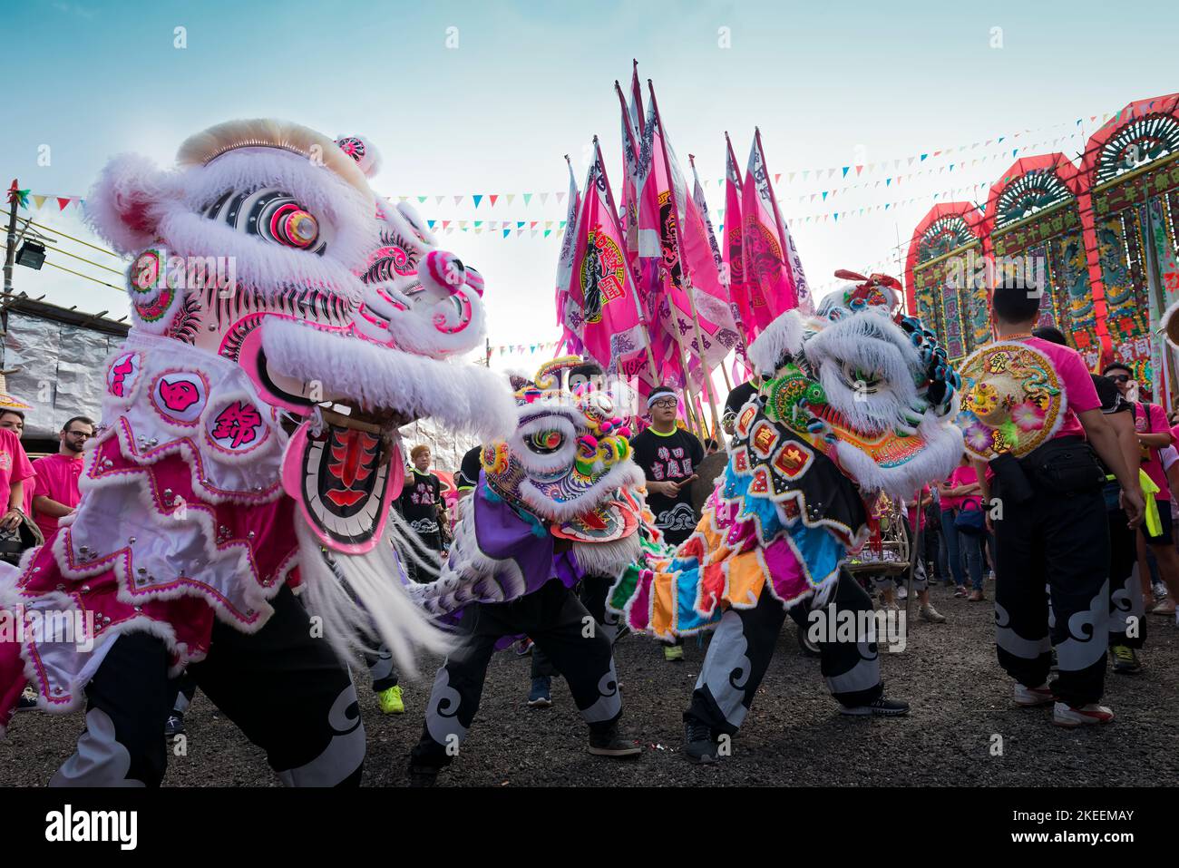 Lion dancers perform with their elaborate, colourful puppets at the decennial Da Jiu festival site, Kam Tin, New Territories, Hong Kong, 2015 Stock Photo