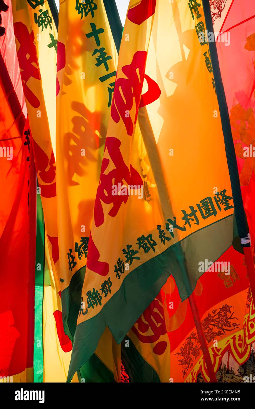 Large brightly coloured pennants used in ceremonial processions at the decennial Da Jiu festival site, Kam Tin, New Territories, Hong Kong, 2015 Stock Photo