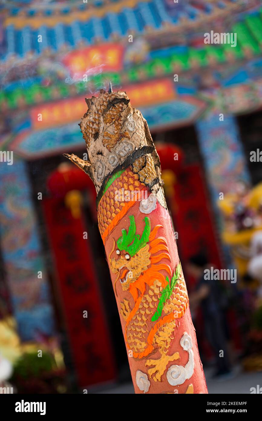 A giant incense stick burning at the entrance to Kat Hing Wai walled village, decorated for the decennial Da Jiu festival, Kam Tin, Hong Kong, 2015 Stock Photo