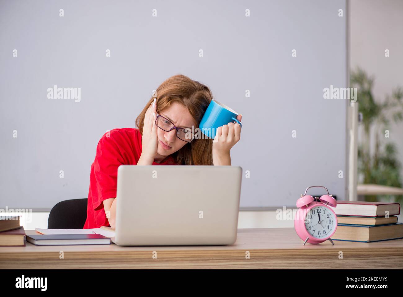 Female student preparing for exams in the classroom Stock Photo - Alamy