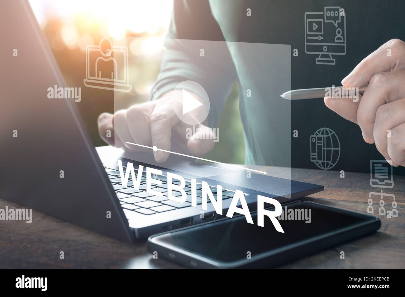 Webinar online. Hand use stylus Browsing webinar on laptop. Virtual learning concept. hand typing on laptop keyboard with Webinar homepage. online edu Stock Photo