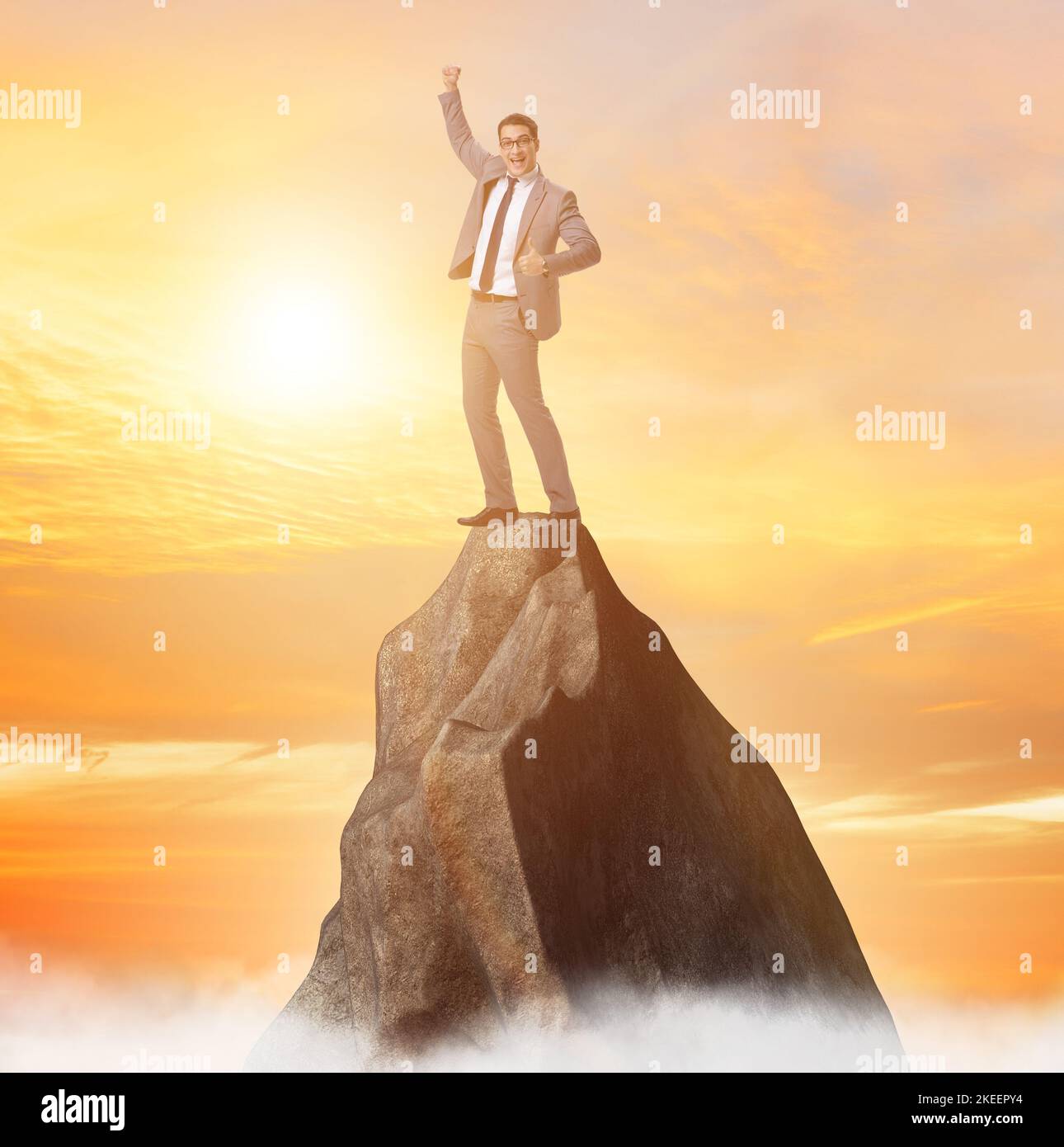 The businessman at the top of mountain Stock Photo - Alamy