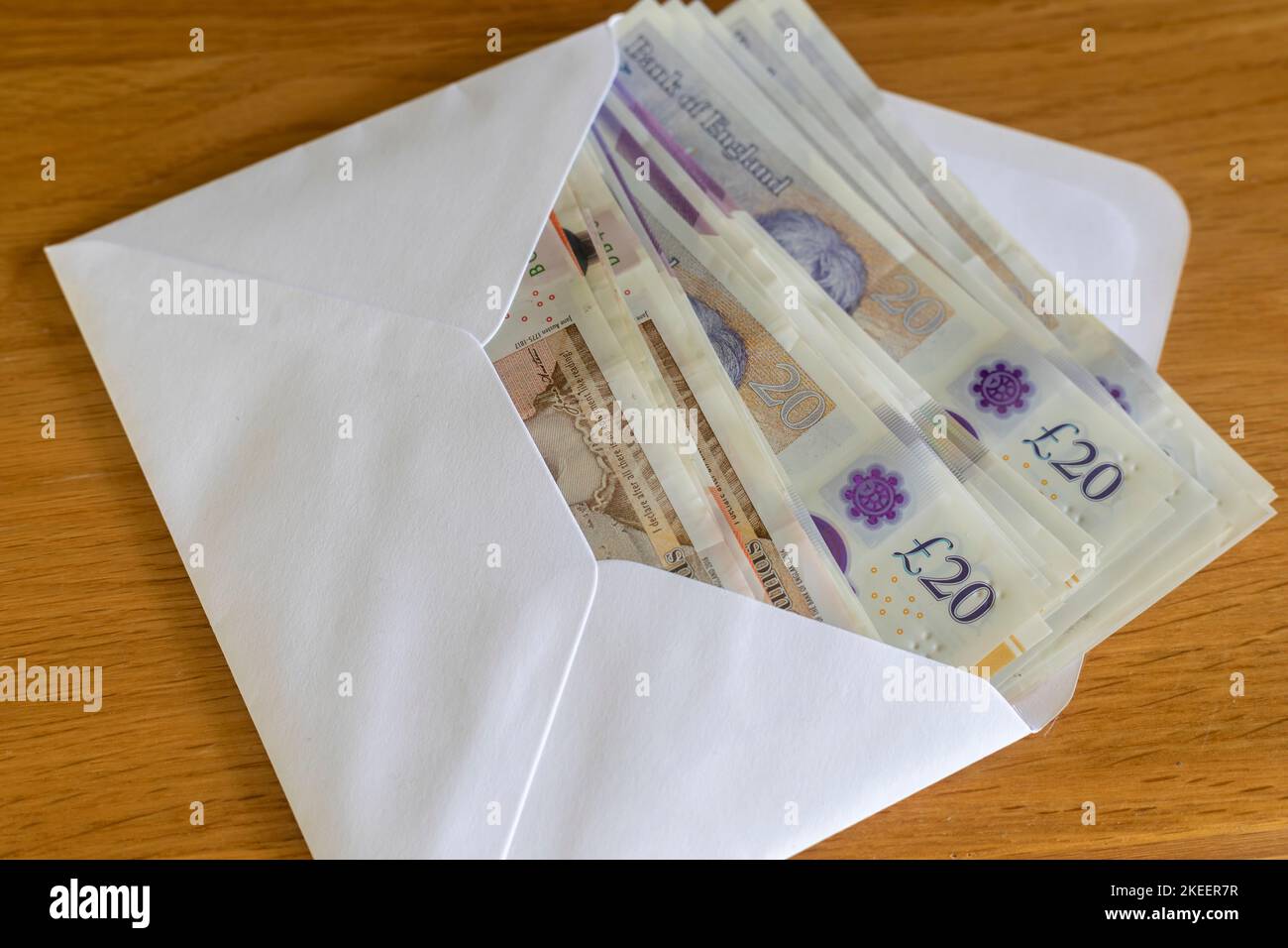 An envelope full of British £20 and £10 pound notes Stock Photo Alamy
