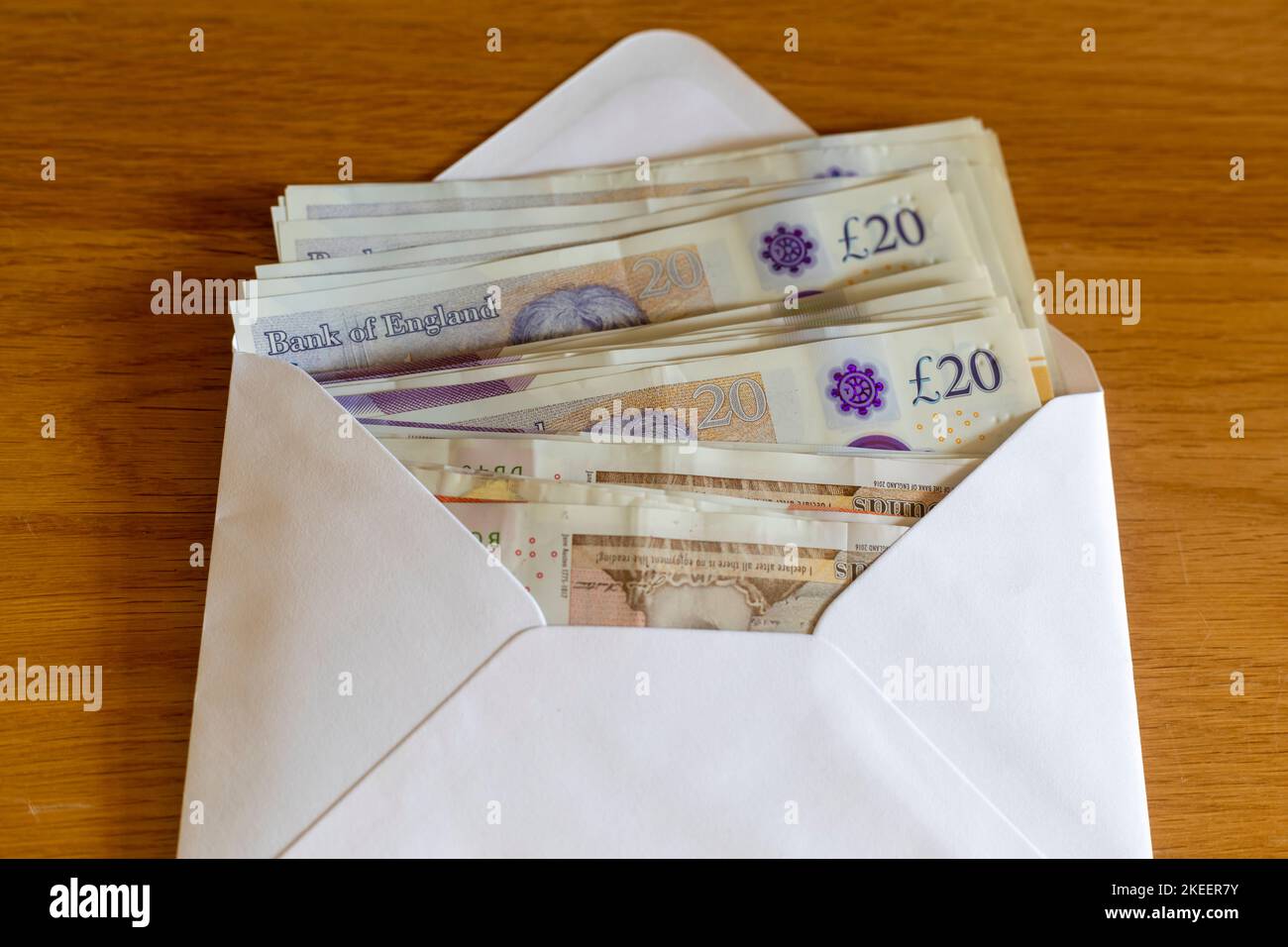 An envelope full of British £20 and £10 pound notes Stock Photo Alamy
