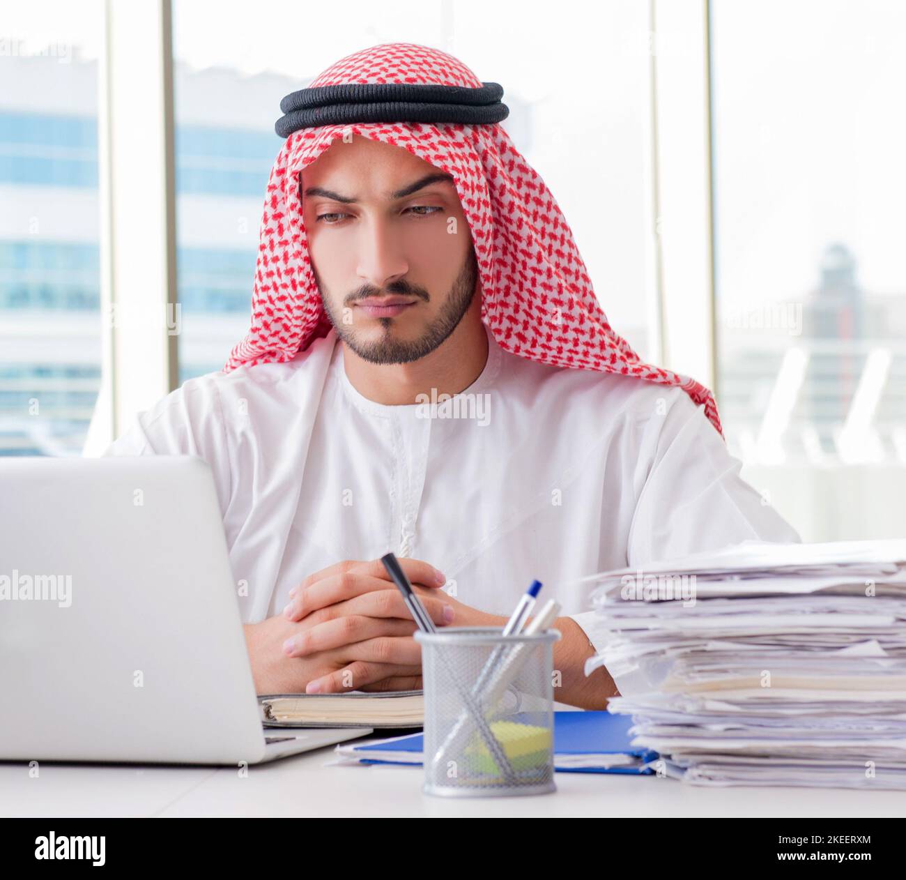 The arab businessman working in the office Stock Photo - Alamy