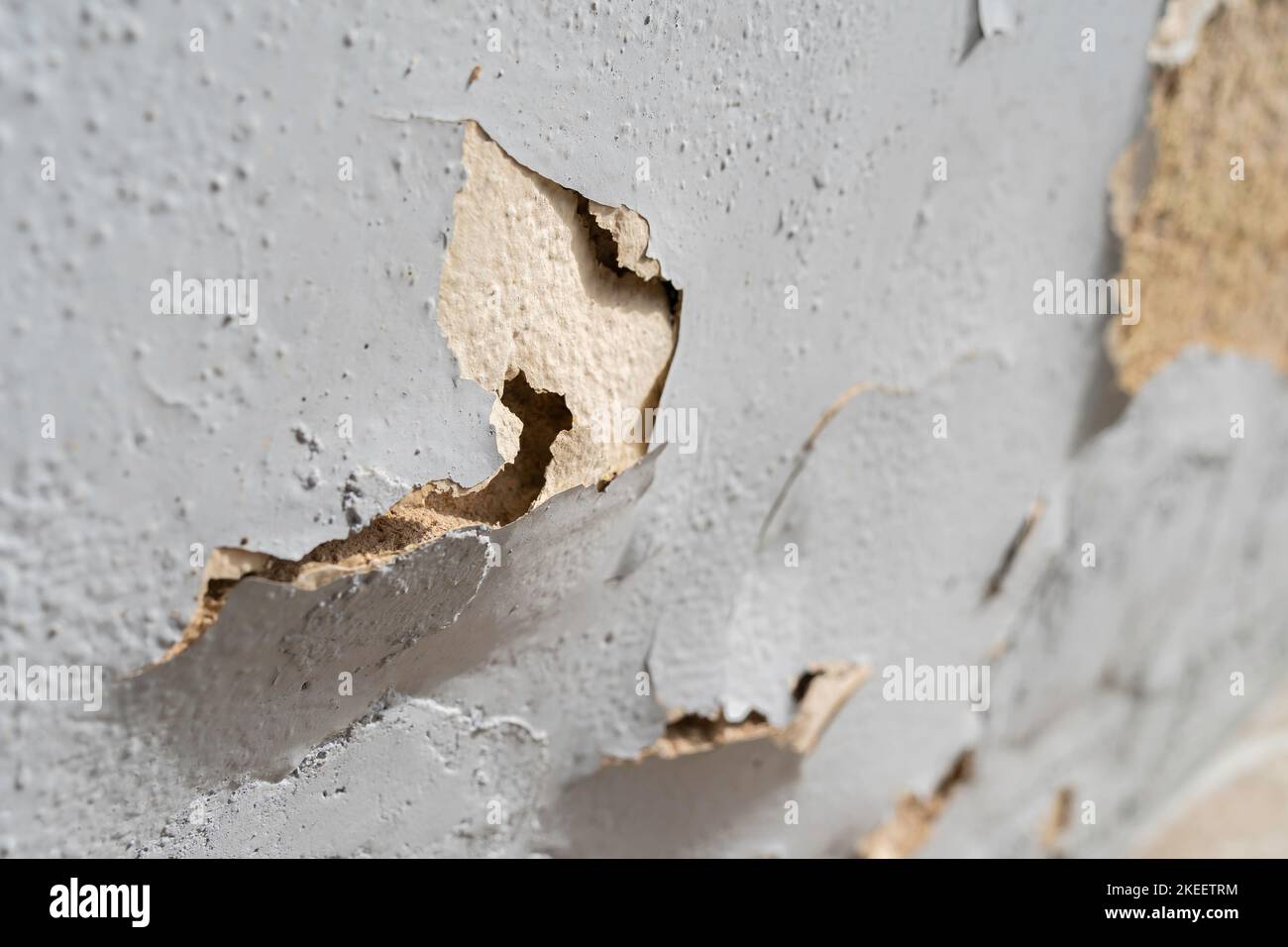 Close-up view of the wall paint peeling off. Stock Photo