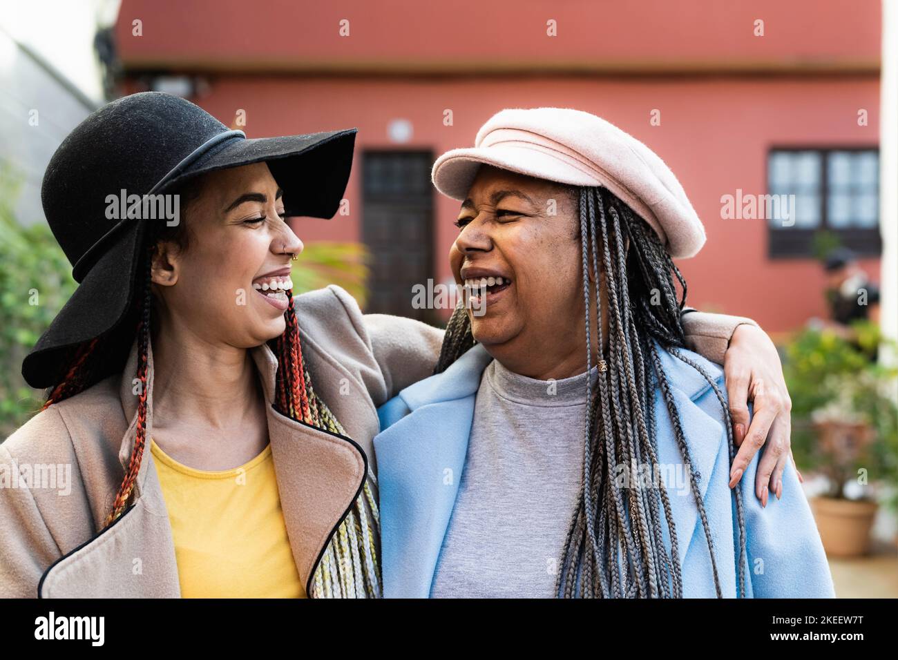 Happy African mother with her daughter having fun in the city - Love and family concept Stock Photo