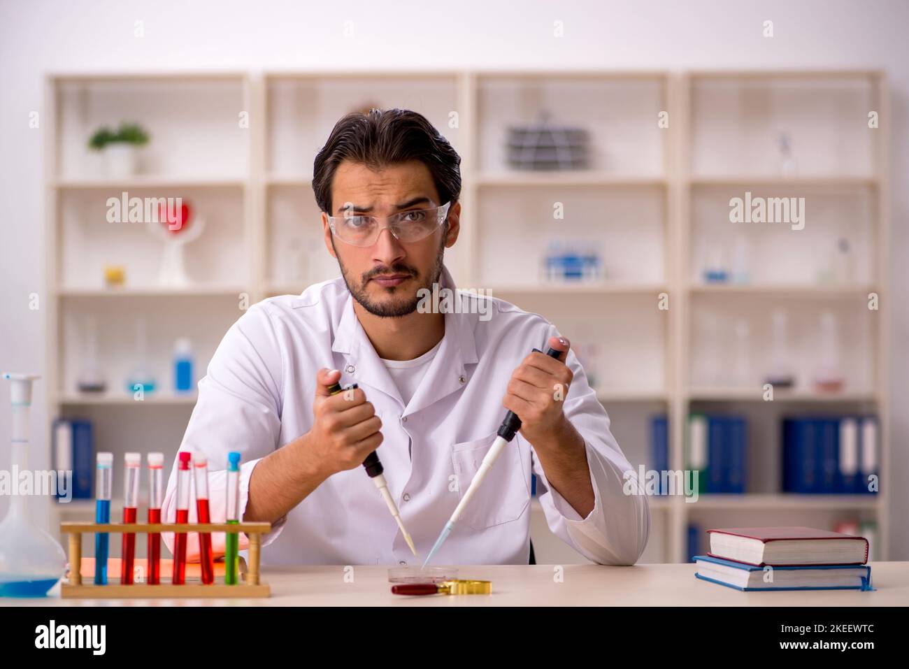 Young Chemist Working At The Lab Stock Photo - Alamy