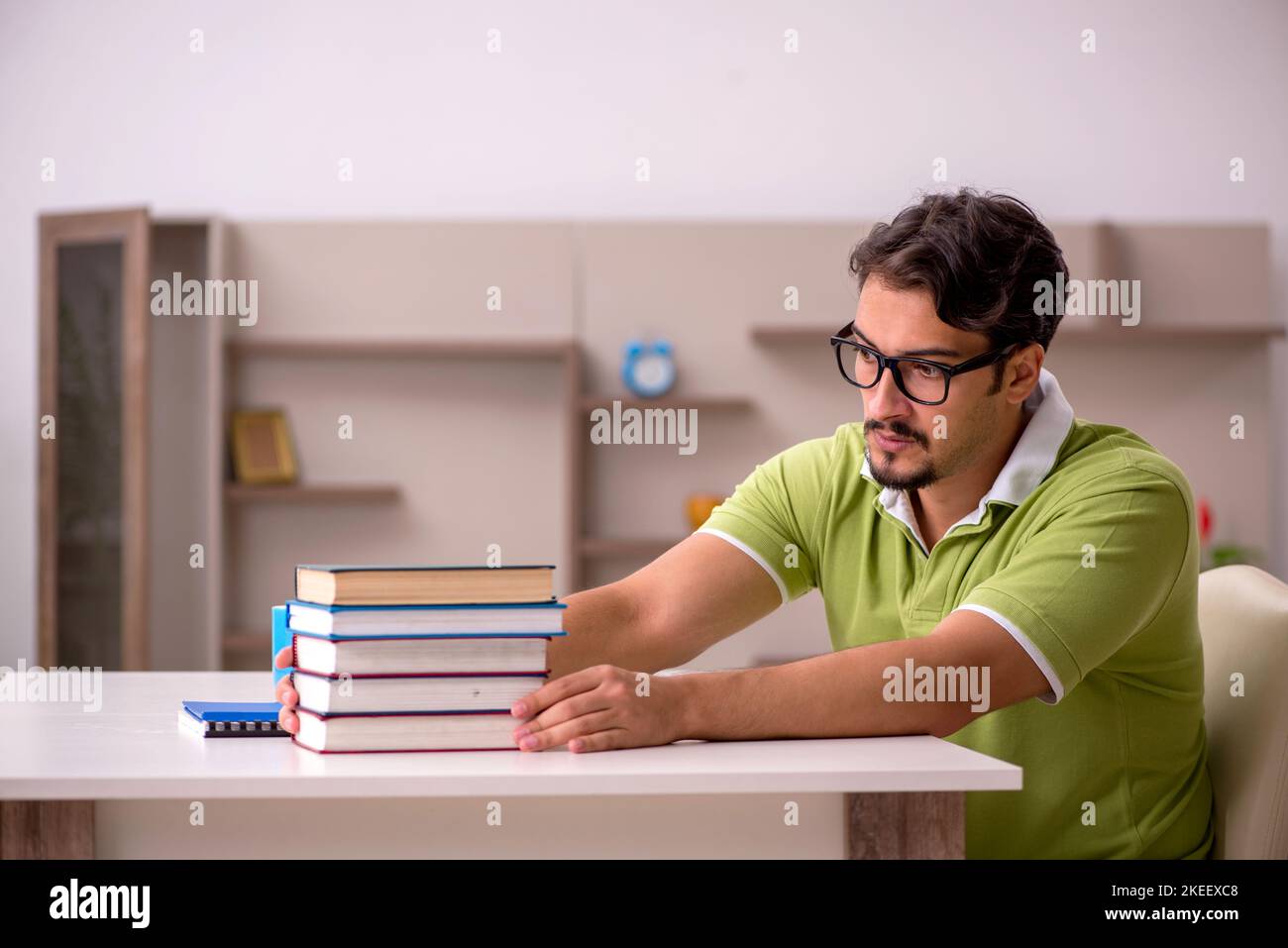 Young student studying at home Stock Photo - Alamy