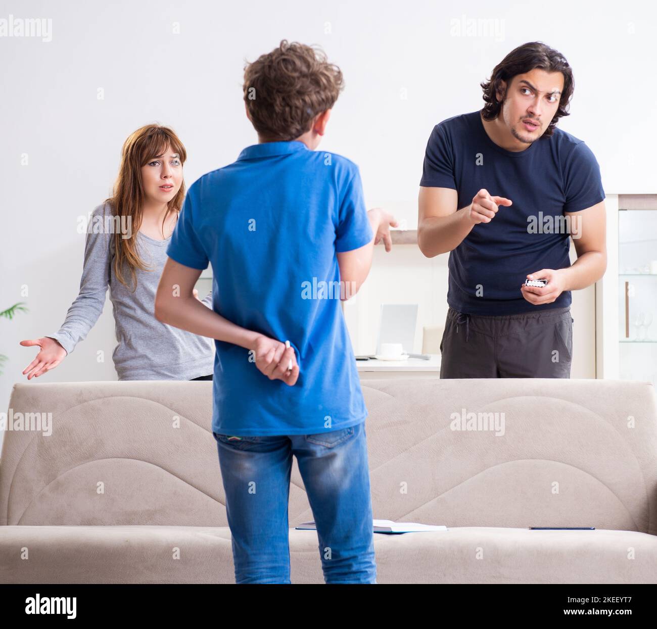 The concept of underage smoking with young boy and family Stock Photo