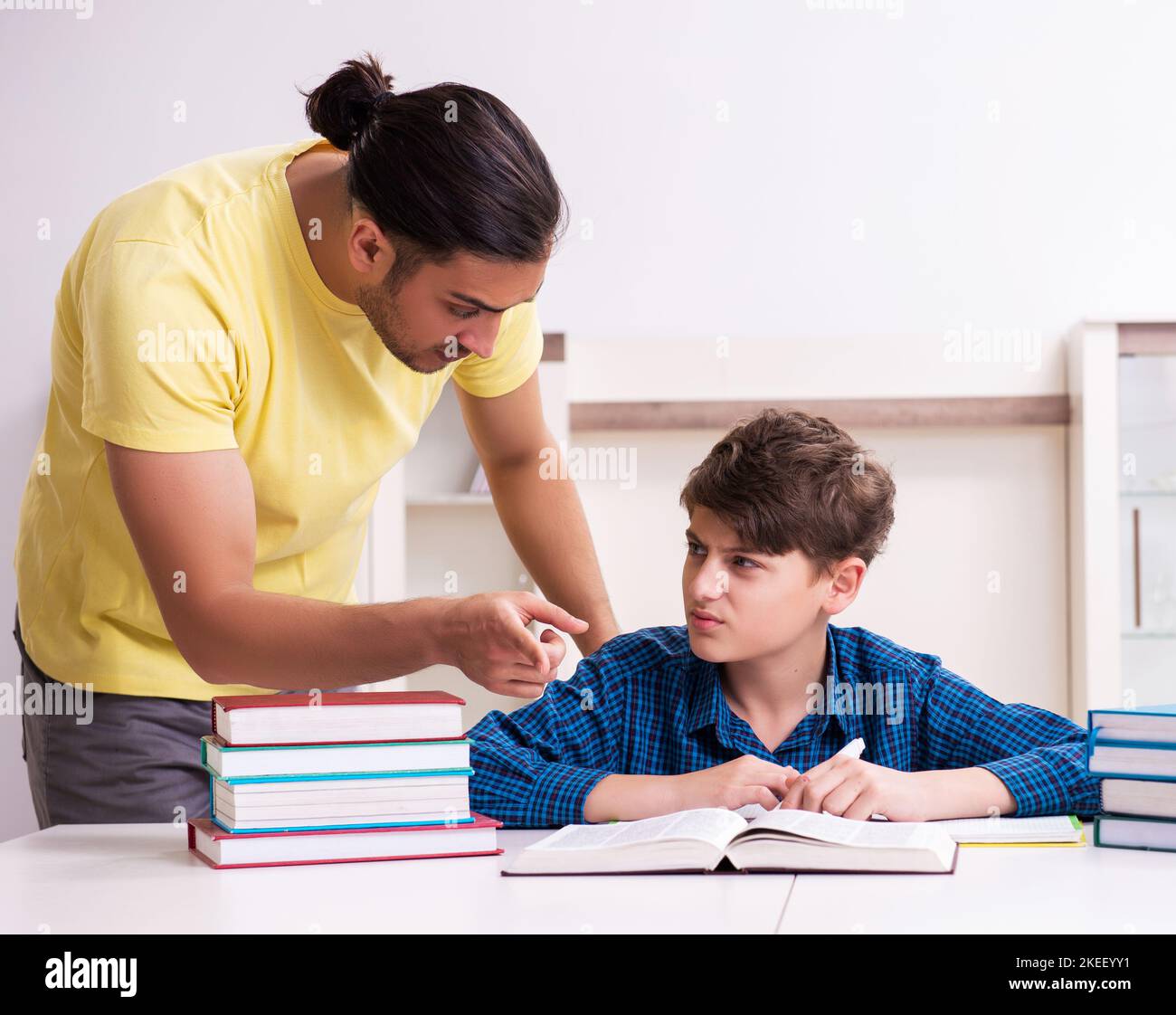 The father helping his son to prepare for school Stock Photo - Alamy