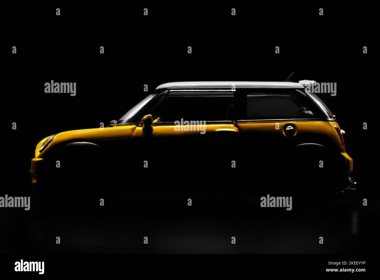 Close up side view silhouette shot of a car on a black background Stock Photo