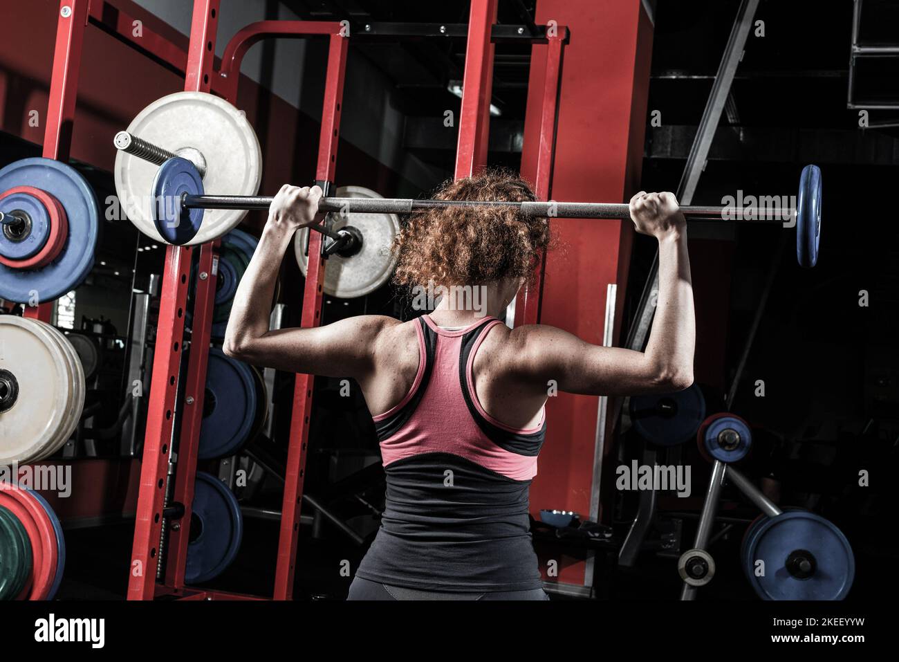 Woman bodybuilder engaged with a barbell in the gym Stock Photo - Alamy
