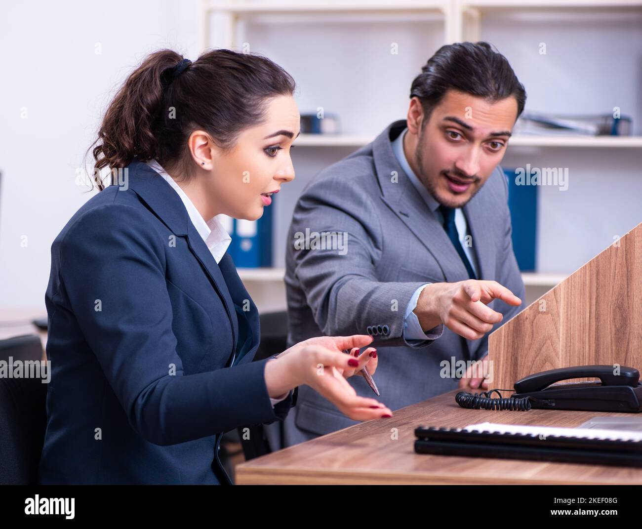 The two employees working in the office Stock Photo - Alamy