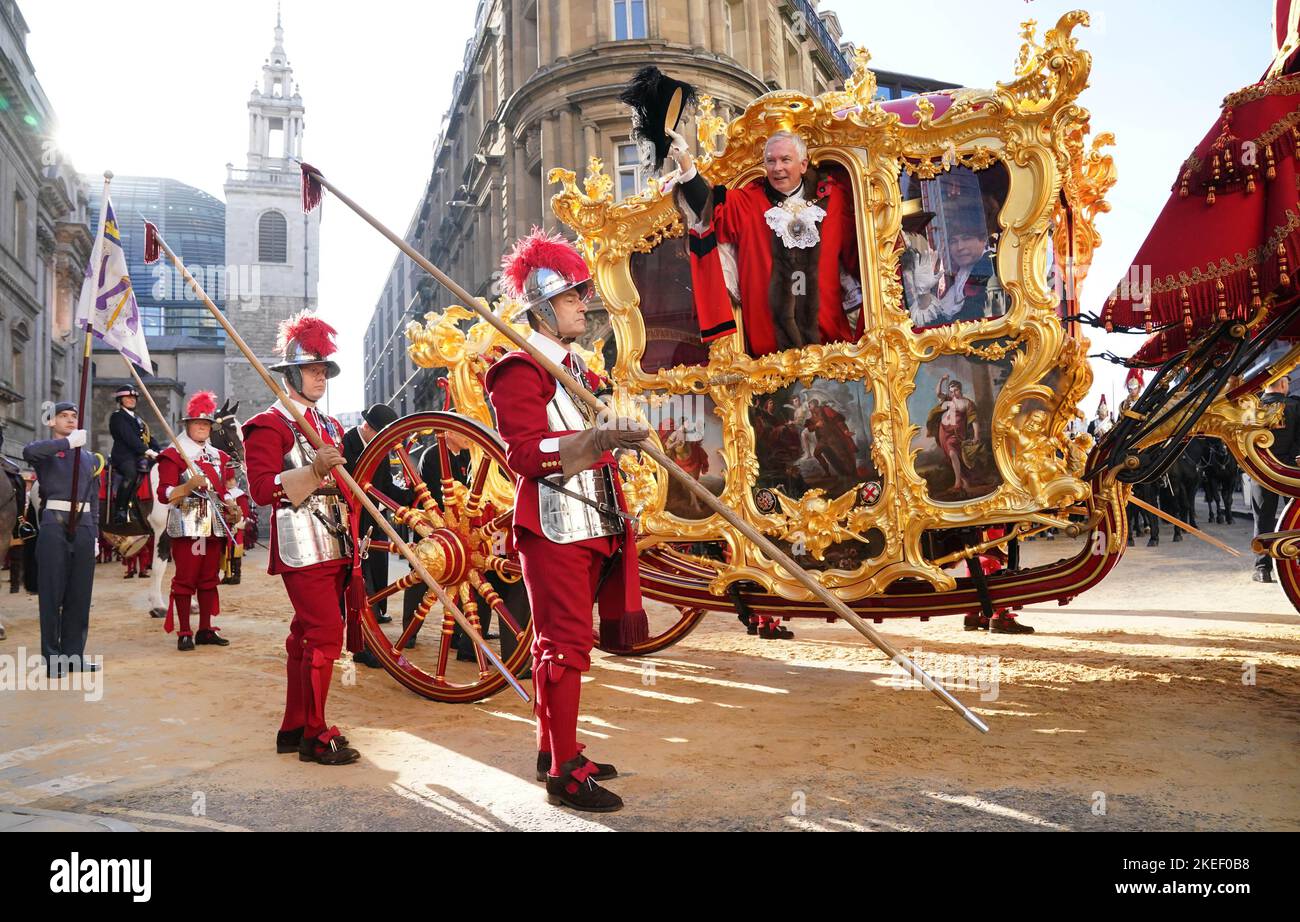The new Lord Mayor of London Nicholas Lyons waves from the Lord Mayor's State Coach outside Mansion House during the Lord Mayor's Show in the City of London. Picture date: Saturday November 12, 2022. Stock Photo